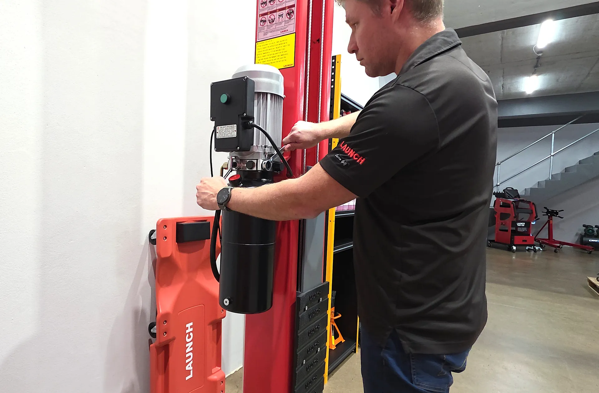 Technician carrying out workshop equipment servicing
